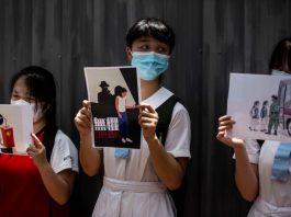 BI_School students hold signs during a pro-democracy protests