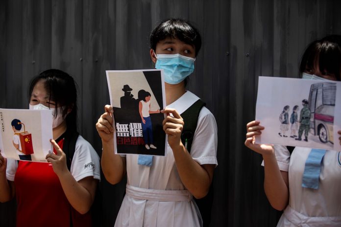 BI_School students hold signs during a pro-democracy protests