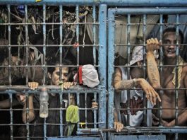 Detainees spend time inside congested prison cells in the Philippines capital.
