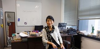 Legislator Claudia Mo sitting on a chair in her office