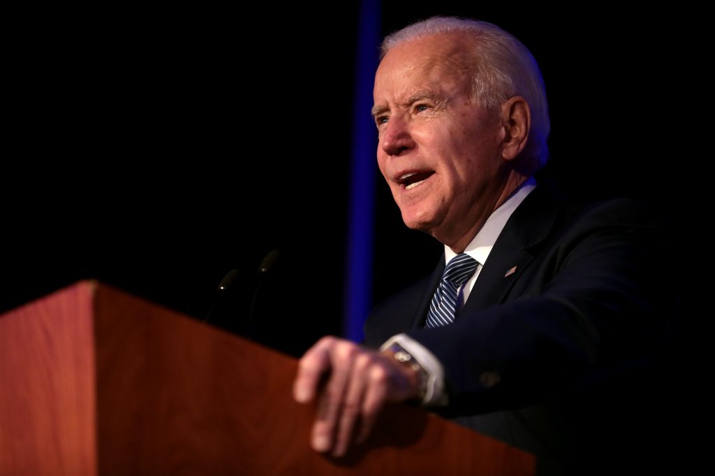 Joe Biden addressing audience from a lectern | Licas News