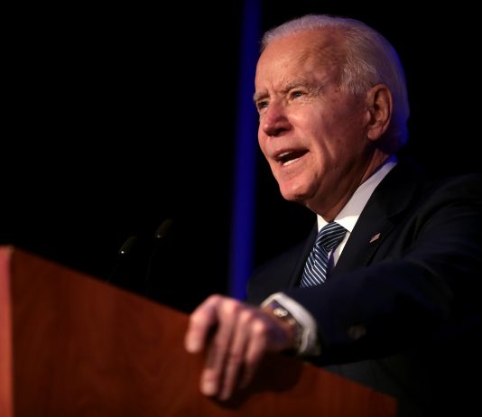 Joe Biden addressing audience from a lectern | Licas News