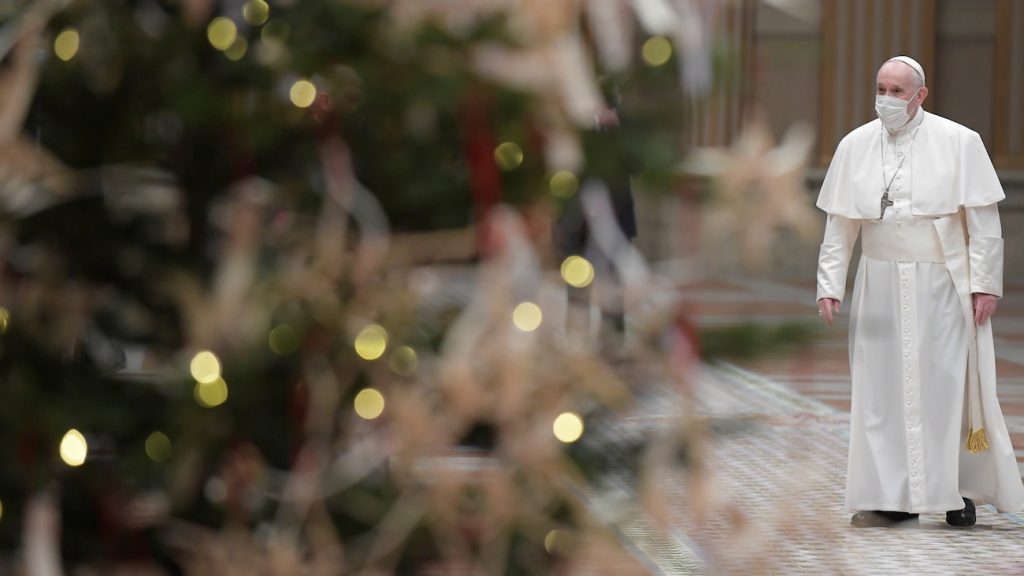 Pope Francis with Christmas tree in foreground