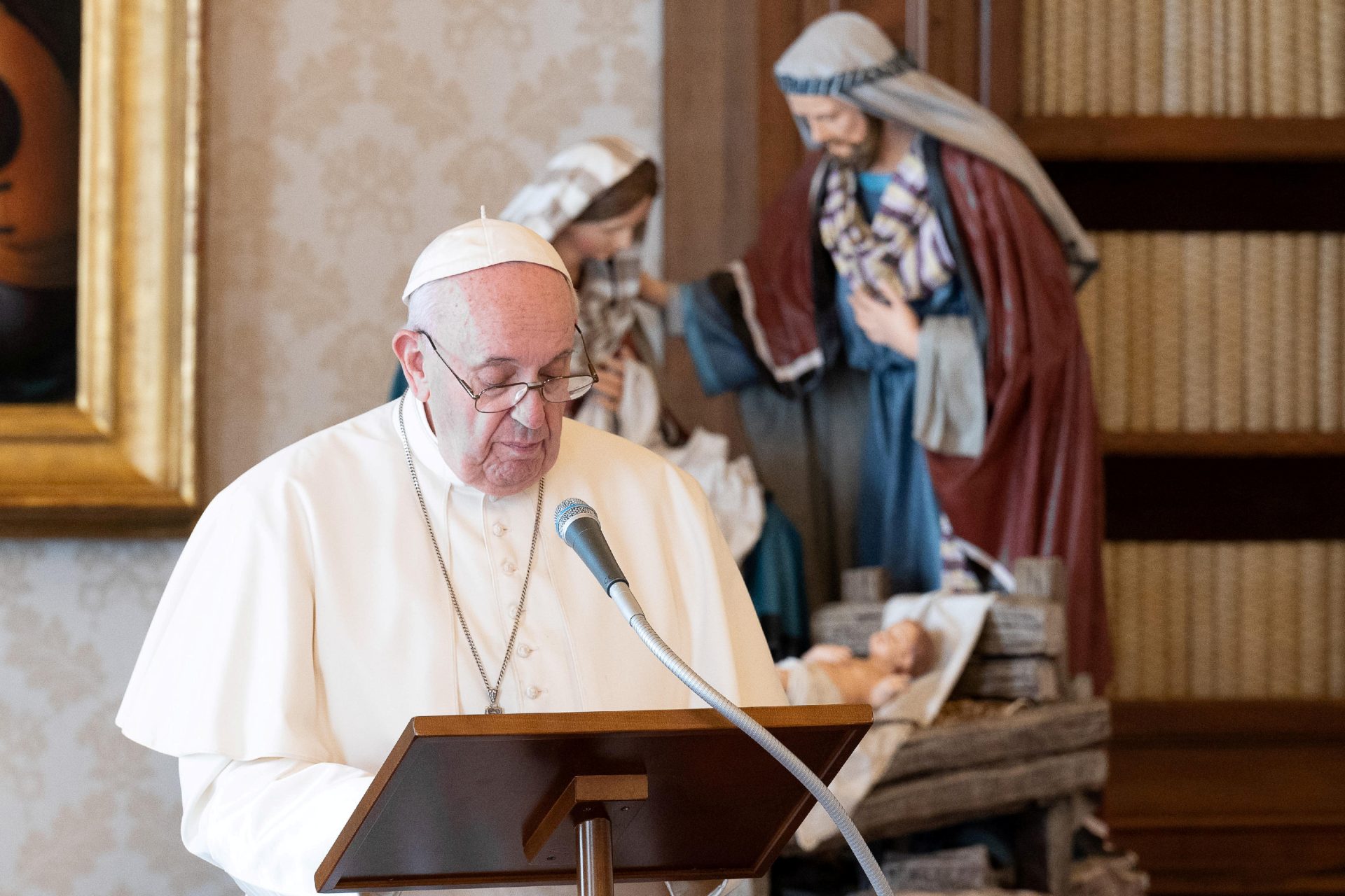Pope Francis giving address behind lectern