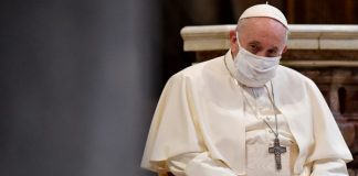 Pope Francis wearing white face mask