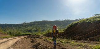 An Aeta woman walking in land development site