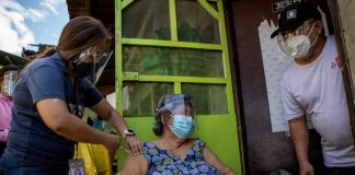 Philippine health workers bring COVID-19 vaccines to bedridden residents