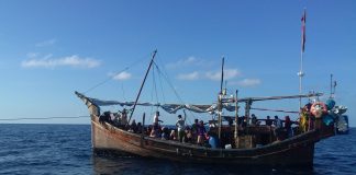 A wooden boat transporting Rohingya refugees in Indonesian waters
