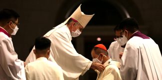 Cardinal Advincula, archbishop of Manila, receives pallium from papal nuncio
