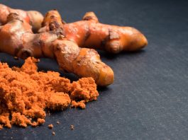 Turmeric roots with turmeric powder