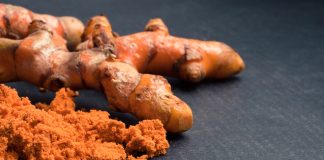 Turmeric roots with turmeric powder