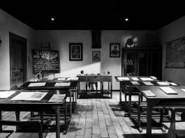 An old school classroom in black and white