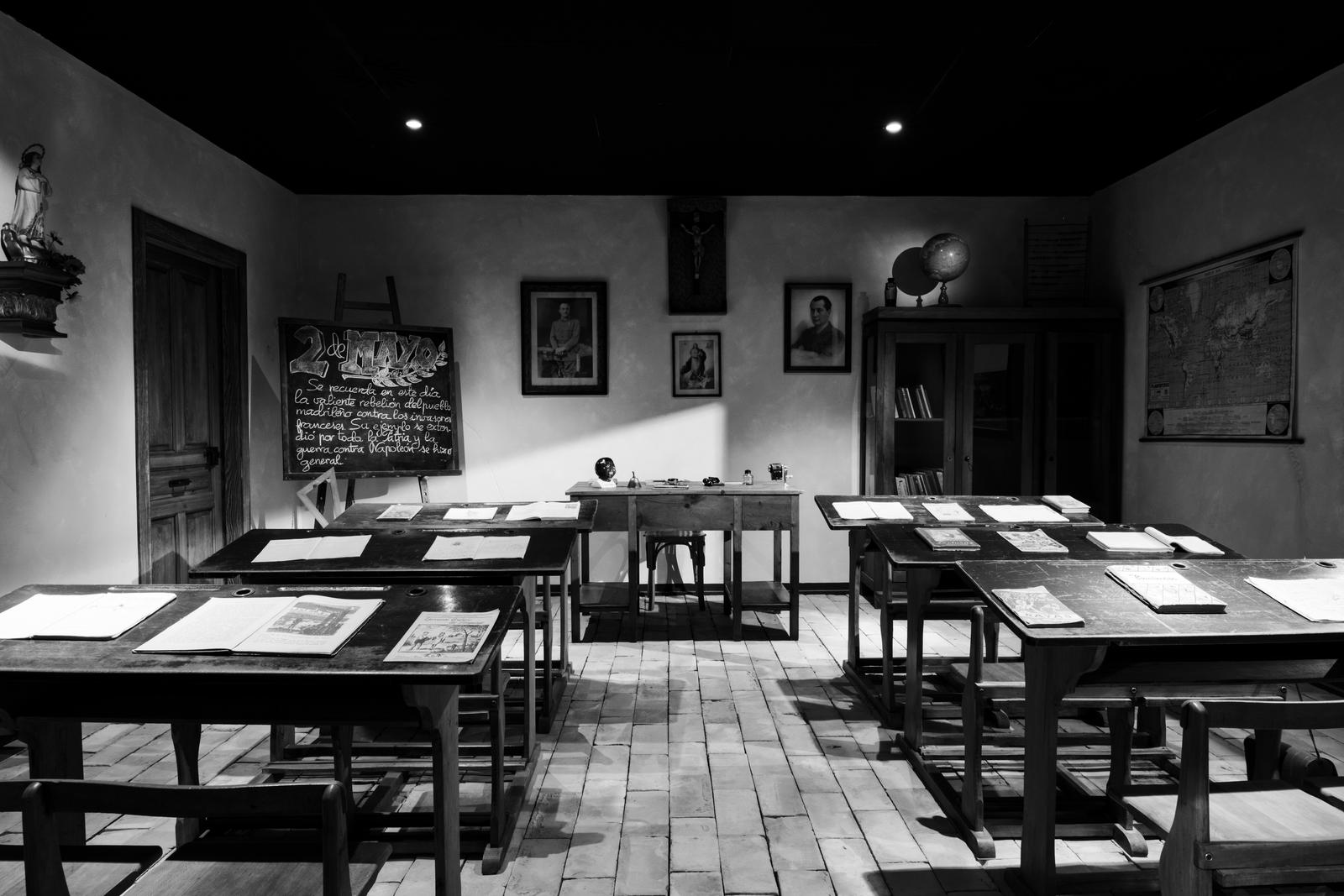 An old school classroom in black and white