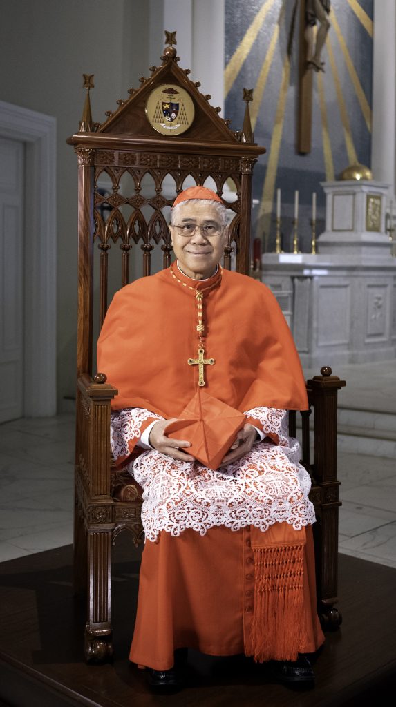 Cardinal William Goh of Singapore sitting down full profile