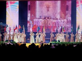 Thai youth holding flags on large stage FABC50