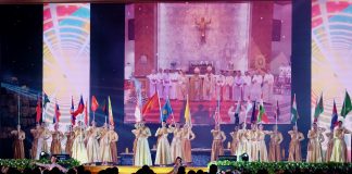 Thai youth holding flags on large stage FABC50