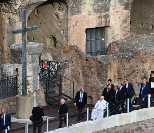 Pope Francis in a wheelchair at the Colisseum