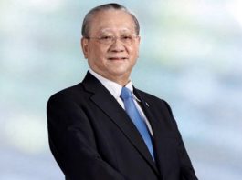 Piti Sithi-amnuai wearing a suit and a light blue tie | Bangkok Bank