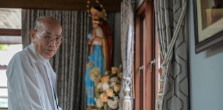 Cardinal Michael Michai Kitbunchu in his office