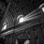 Black and white photo of interior of St. Peter's Basilica, Vatican City.