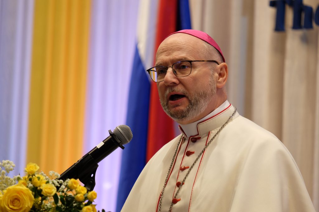 Archbishop Peter Bryan Wells speaking from a lectern