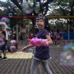 Girl playing with bubble