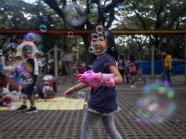 Girl playing with bubble