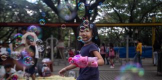 Girl playing with bubble