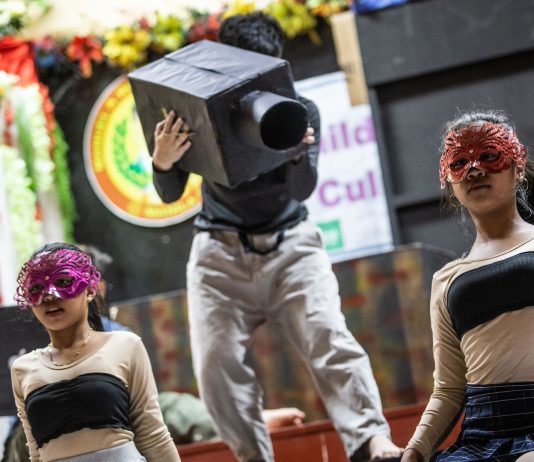 Children acting on stage depicting online sexual exploitation