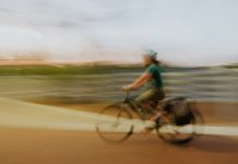 A female cyclist in a blurry photo in the Philippines