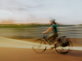 A female cyclist in a blurry photo in the Philippines