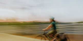 A female cyclist in a blurry photo in the Philippines