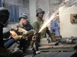 Young students in Bangladesh in a workshop with sparks flying