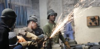 Young students in Bangladesh in a workshop with sparks flying