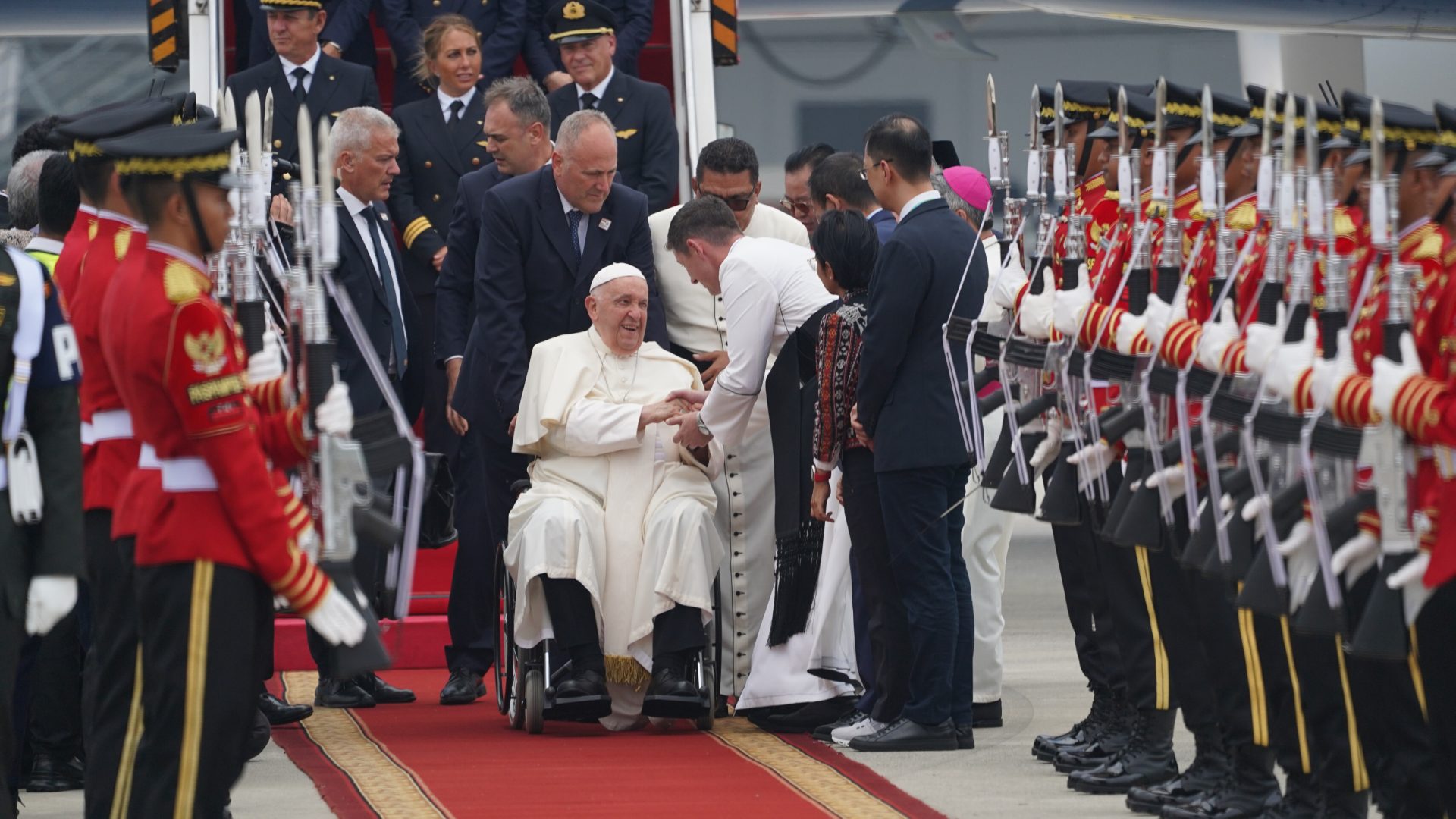 Pope Francis on a wheelchair at the airport as he arrives in Indonesia.