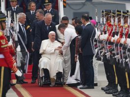 Pope Francis on a wheelchair at the airport as he arrives in Indonesia.