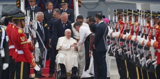 Pope Francis on a wheelchair at the airport as he arrives in Indonesia.