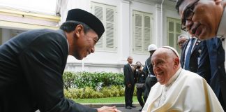 Pope Francis shakes hand President Joko Widodo of Indonesia