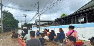 Rescuers providing boats to ferry flood victims in Chiang Rai, Thailand