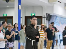 Friar Derrick Yap performs at rehearsal for the Papal Mass