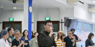 Friar Derrick Yap performs at rehearsal for the Papal Mass