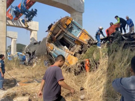 Derailed train carriages after a crane collapsed onto a passenger train (Thailand)