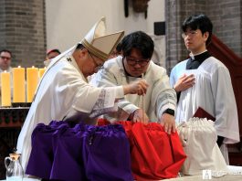 Archbishop Peter Soon-taick Chung blesses the sacred oils during the Chrism Mass at Myeongdong Cathedral on April 2, joined by clergy of the Archdiocese of Seoul. The oils will be used for the sacraments throughout the year. Photo by Catholic Archdiocese of Seoul